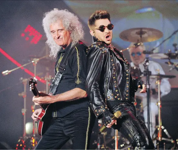  ?? CHRIS PIZZELLO/INVISION/AP ?? Brian May of Queen, left, and Adam Lambert perform in Los Angeles. Queen has clearly found somebody to love in Lambert. Since joining forces with the American Idol runner-up for a series of shows in 2012, the band that ruled rock radio in the 1970s and...