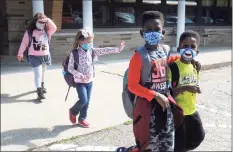  ?? Ned Gerard / Hearst Connecticu­t Media ?? Students leave Sunnyside Elementary School in Shelton at the end of the school day on Wednesday.