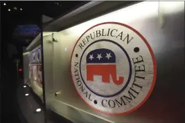  ?? RAINIER EHRHARDT — THE ASSOCIATED PRESS FILE ?? The Republican National Committee logo is shown on the stage as crew members work at the North Charleston Coliseum in North Charleston, S.C., on Jan. 13, 2016,