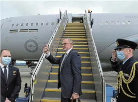  ?? Picture:LUKAS COCH/REUTERS ?? ALL SYSTEMS GO: Australian Prime Minister Anthony Albanese boards a flight in Canberra to attend the Quad leaders meeting in Tokyo, Japan, yesterday