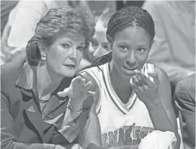  ?? ASSOCIATED PRESS ?? Tennessee head coach Pat Summitt talks with Chamique Holdsclaw on the bench as Holdsclaw ices her knees in the final minutes of their game against Florida at the SEC women's tournament in 1999.