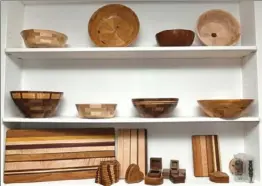  ??  ?? At left, wooden bowls and other products sit on display at Mr. O’Connor’s business in Penn Hills.