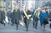  ?? CRAIG RUTTLE — THE ASSOCIATED PRESS ?? Irish Prime Minister Leo Varadkar, center left, New York Democratic Gov. Andrew Cuomo and Rep. Peter King, R-N.Y., walk along Fifth Avenue during the St. Patrick’s Day parade Saturday in New York.