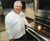  ?? The Associated Press ?? CATERING TO CLIENTS: In this photo from July 18, private chef Ken McNamee poses for a photo in Seattle. McNamee has cooked in exclusive clubs around the world, yet he’s sometimes overwhelme­d by the scale of wealth around Seattle.