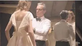  ?? LAURIE SPARHAM/FOCUS FEATURES ?? "Phantom Thread" could be the last movie for Daniel Day-Lewis (right, with Vicky Krieps). The fashion drama is scheduled to open in Central Florida on Jan. 19.