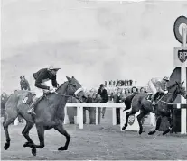  ??  ?? Running on empty: Crisp (right) is beaten by Red Rum in 1973 having led the Grand National field by 30 lengths
