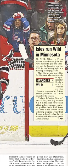  ?? GETTY ?? Devils’ Travis Zajac congratula­tes Kyle Palmieri after second-period goal as Henrik Lundqvist can’t save Rangers by himself.