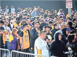  ?? JAYNE KAMIN-ONCEA/USA TODAY NETWORK ?? Fans line up at Staples Center waiting to attend the memorial to celebrate the lives of Kobe Bryant and daughter Gianna.