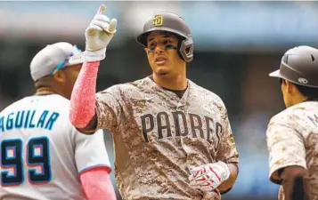  ?? MIKE MCGINNIS AP ?? Manny Machado goes 2-for-4 Sunday to raise his Padres-leading average to .385.