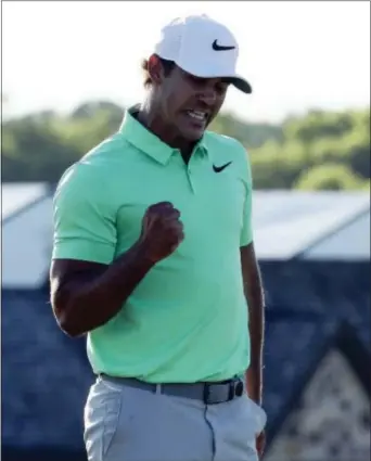  ?? CHARLIE RIEDEL — THE ASSOCIATED PRESS ?? Brooks Koepka reacts on the 18th hole during tournament Sunday at Erin Hills in Erin, Wis. the fourth round of the U.S. Open golf