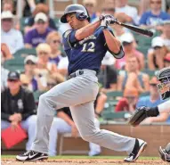  ?? MATT KARTOZIAN / USA TODAY SPORTS ?? Utility infielder Ivan De Jesús Jr., in camp with the Brewers on a minor-league contract, has shined but his future is uncertain.