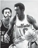  ?? WILLIAM HOTZ JR. ?? Earl “The Pearl” Monroe of the Bullets drives around Knicks Hall of Famer Walt Frazier. Fifty years ago, in April, the teams met in the best-of-seven NBA Eastern Conference finals. The Bullets white-knuckled a series win, but were ultimately swept in theNBA Finals by the Milwaukee Bucks.