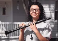  ?? Arnold Gold / Hearst Connecticu­t Media ?? Cooperativ­e Arts and Humanities High School senior and clarinetis­t in the band, Kiana Flores, 17, is at her home in New Haven on Saturday.