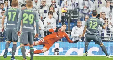  ??  ?? Real Sociedad’s Willian Jose scores their first goal from the penalty spot. — Reuters photo