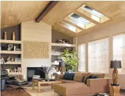  ?? Photo courtesy of Innovative Skylights ?? Skylights and blinds enhance the “fifth wall” in this living room.