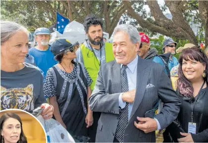  ?? Photo / Mark Mitchell ?? Winston Peters was issued with a trespass notice over his visit to the protest. Jacinda Ardern (left) has urged the Speaker to seek consensus over the issue.