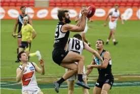  ?? Photograph: Dave Hunt/AAP ?? Justin Westhoff of the Power takes a mark during the Round 6 AFL match between Port Adelaide and the GWS Giants on the Gold Coast on Sunday.