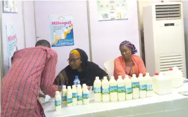  ??  ?? Hajiya Rukaiya Gwamna (middle) attending to a participan­t in one of the dairy events in Abuja recently