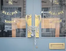  ?? Picture: PA Wire ?? Chains secure the doors of a closed Fuller’s pub