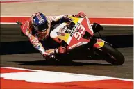  ?? Eric Gay / Associated Press ?? Marc Marquez steers through a turn during an open practice session for the MotoGP Grand Prix of the Americas motorcycle race at the Circuit of the Americas Saturday in Austin, Texas.