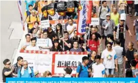  ??  ?? HONG KONG: Protestors take part in a National Day pro-democracy rally in Hong Kong. —AFP