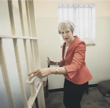  ?? PICTURE: STEFAN ROUSSEAU/PA ?? 0 Theresa May visits Robben Island prison near Cape Town