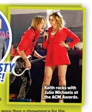  ??  ?? Keith rocks with Julia Michaels at the ACM Awards.