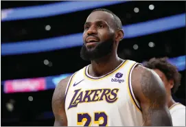  ?? AP PHOTO/MARK J. TERRILL ?? Los Angeles Lakers forward LeBron James looks toward fans after scoring during the second half of an NBA basketball game against the Denver Nuggets Saturday, March 2, 2024, in Los Angeles.