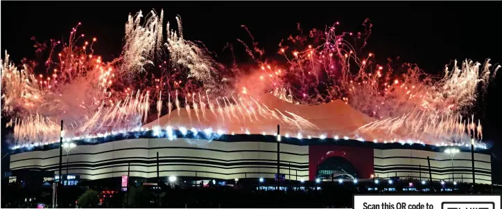  ?? ?? Dazzling in the desert : Fireworks light up the Al Bayt stadium – designed to look like a traditiona­l Bedouin tent