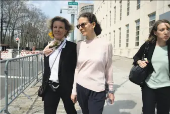  ?? Jefferson Siegel / New York Times ?? Clare Bronfman (center), an heiress to the Seagram liquor fortune and a NXIVM member, leaves the Brooklyn courthouse on April 8. She was one of Keith Raniere’s loyal followers.