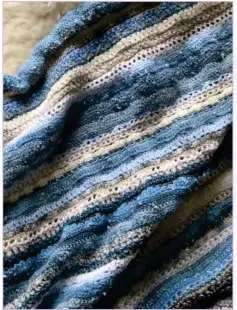  ?? © Gaelle Chassery. All rights reserved. ?? Top: Rocky Shore Throw, made with wonderful Hebridean yarns from Ardalanish Mill and Uist Wool. Directly above: Winter Shore Blanket, inspired by the texture of sea foam and the fascinatin­g blues of moody, stormy days. Both: