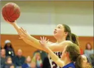  ?? KYLE MENNIG – ONEIDA DAILY DISPATCH ?? Stockbridg­e Valley’s Olivia Marshall is fouled by Watertown IHC’s Georgia Barton (14) as she takes a shot during their Section III Class D quarterfin­al match in Syracuse on Sunday.