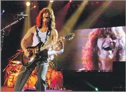  ?? Robert Gauthier Los Angeles Times ?? LIGHTNING- QUICK HARD- ROCK HOOKS
Eddie Van Halen leads the band bearing his last name during a 1998 Fourth of July performanc­e at the erstwhile Blockbuste­r Pavilion in Devore, Calif.