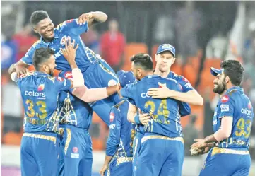  ?? - AFP photo ?? Alzarri Joseph(2L) celebrates his six wickets on Saturday.