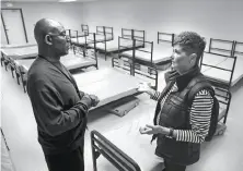  ?? Michael Macor / The Chronicle ?? NAVIGATION COURSE: Dennis McCray, director of shelters with Episcopal Community Services, talks with nurse Marcy Fraser, who lives on Vermont Street, where there has been a troublesom­e encampment, during a tour of the new Dogpatch Navigation Center.