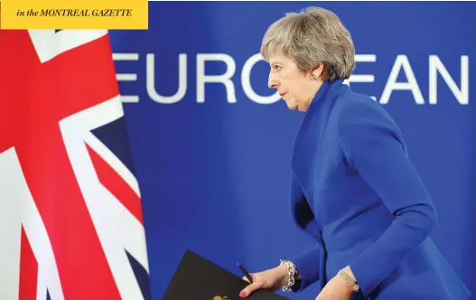  ??  ?? U.K. Prime Minister Theresa May leaves after a press conference following a special meeting of the European Council to endorse the draft Brexit agreement in Brussels on Sunday. The European Union’s top official urged British lawmakers to ratify the Brexit deal May has negotiated with European leaders, warning that it will not be modified.