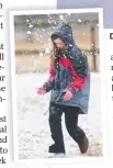  ??  ?? Caitlin Hall, 8, cops a snowball.
Dan Toohill and Josie Carter snapped this winter scene at Wallangarr­a.