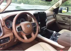  ?? STAFF PHOTO BY MARK KENNEDY ?? The interior of the 2019 Ram 1500 is full of soft-touch materials in Mountain Brown and Soft Frost Beige.
