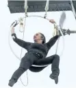  ?? BILL WIPPERT /AP ?? Erendira Wallenda performs a series of acrobatic maneuvers, including hanging by her teeth.