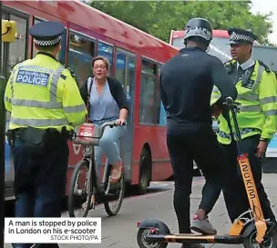  ?? STOCK PHOTO/PA ?? A man is stopped by police in London on his e-scooter