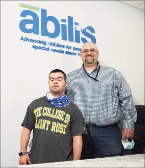  ?? Tyler Sizemore / Hearst Connecticu­t Media ?? Abilis client Joe Lupinacci, left, and Abilis Director of Competitiv­e Employment Matthew Miceli together at Abilis in the Glenville section of Greenwich on May 26. COVID- 19 affected the employment rate for people with disabiliti­es more so than those without disabiliti­es. Lupinacci was furloughed from his job as an aquatics assistant at the New Canaan YMCA during the pandemic.