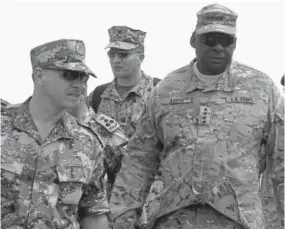  ?? Associated Press file ?? Jordanian Prince Feisal bin Al-hussein, left, and U.S. soldiers inspect 18-nation military exercises in a field near the border with Saudi Arabia, in Mudawara, 174 miles south of Amman, Jordan, in 2015.