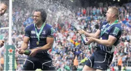  ?? INPHO ?? Ian Madigan hits a penalty for Ulster, and (left) celebratin­g Leinster’s Heineken Cup win over Ulster in 2012 with Isa Nacewa, Brad Thorn and Jamie Heaslip