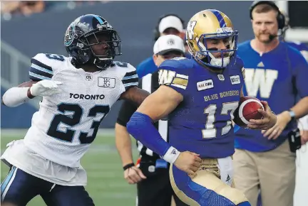  ?? KEVIN KING FILES ?? Argonauts defensive-back T.J. Heath chases Blue Bombers QB Chris Streveler out of bounds during their game last week. The Alouettes traded for Heath on Sunday and he will start for Montreal on Friday night against the Tiger-Cats.