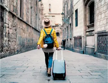  ?? MARTIN-DM/GETTY ?? Traveling light takes organizati­on but will help you lose your fear that an airline will lose your luggage.