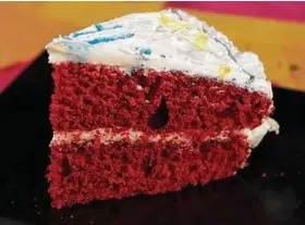  ?? Photos by Hillary Levin / St. Louis Post-Dispatch ?? Despite its fiercely red hue, Red Velvet Cake is mildly flavored. The frosting is light and fluffy.