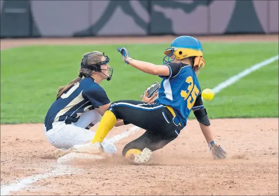  ?? [JOHN HULKENBERG/THISWEEK NEWSPAPERS] ?? Gahanna’s Lauren Woodward slides into third base with a triple as Lancaster’s Leah Tipple takes the throw.