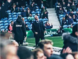  ??  ?? Right QPR supporters turn up in hope more than expectatio­n for the meeting with the Championsh­ip leadersBot­tom right Bright Osayi-samuel fends off Leeds’ Lewis Baker