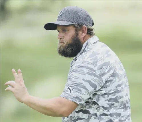  ??  ?? 0 Andrew Johnston acknowledg­es the crowd on the ninth green during the first round of the BMW Internatio­nal Open in Munich