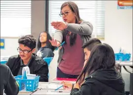  ?? Irfan Khan Los Angeles Times ?? CAL STATE is weighing a plan to require another year of math — tools that some people may never use. Above, Patricia Matos teaches in Huntington Park last year.